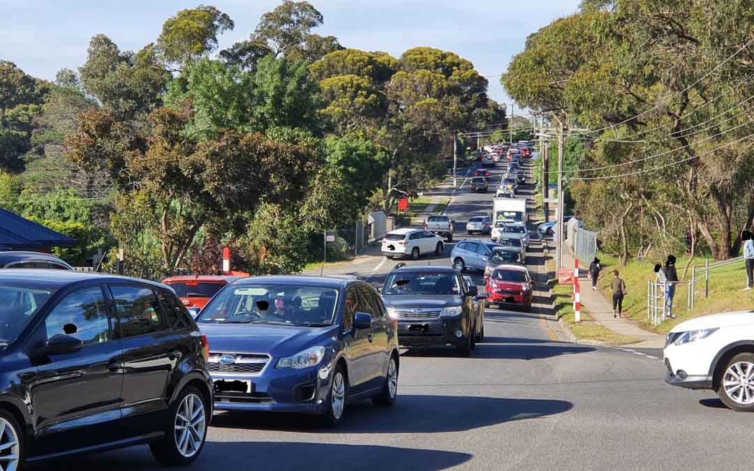 Queue of cars outside a local school